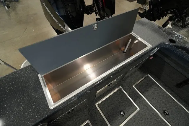 Slide: The Image of An open storage compartment on a 2027 Thunder Jet 210 Luxor Limited boat. - 12