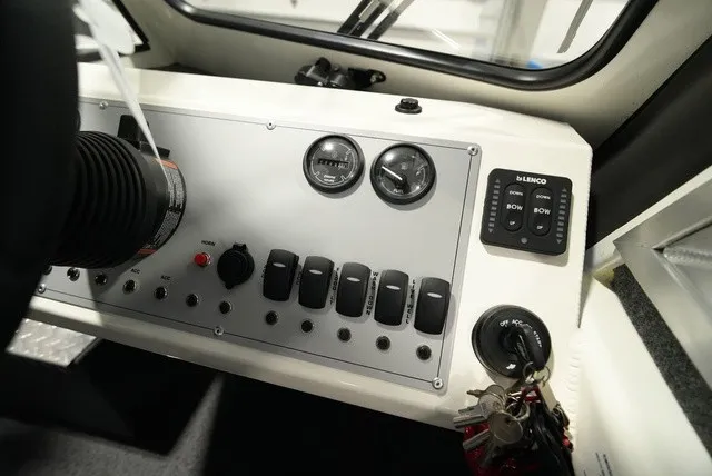 Slide: The Image of The image shows the dashboard of a Thunder Jet 210 Luxor Limited with various switches and gauges. - 20