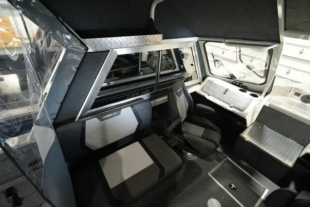 Slide: The Image of Interior of the 2027 Thunder Jet 210 Luxor Limited with modern seating and sleek design. - 16