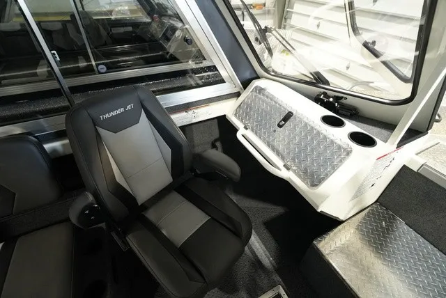 Slide: The Image of Interior of the 2027 Thunder Jet 210 Luxor Limited with padded seat and diamond-patterned dashboard. - 22