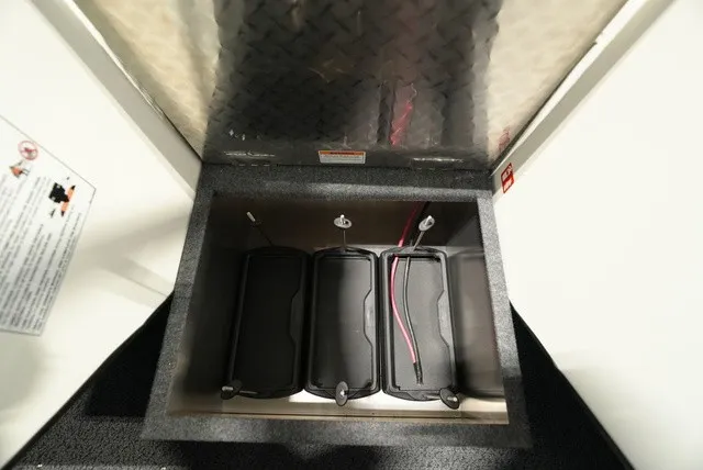 Slide: The Image of Battery compartment with three batteries in the 2027 Thunder Jet 210 Luxor Limited. - 26