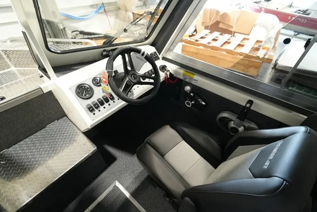 Slide: The Image of Interior of the 2027 Thunder Jet 210 Luxor Limited with steering console and seat. - 18