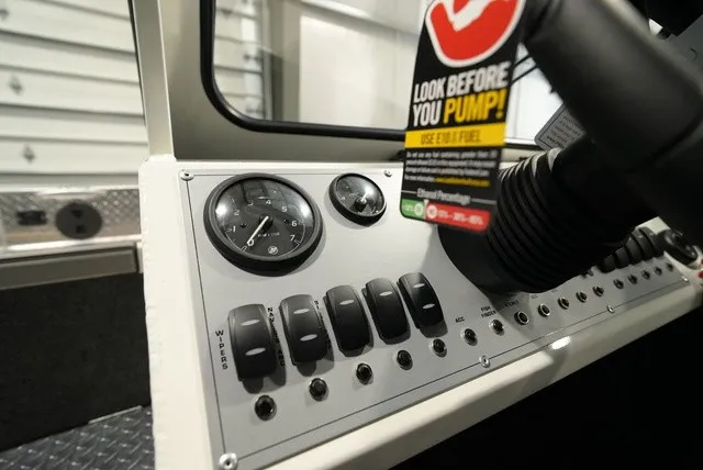 Slide: The Image of Dashboard with switches and gauges in a Thunder Jet 210 Luxor Limited boat. - 19