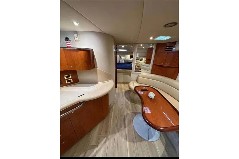 Slide: The Image of Luxurious interior of 2001 Sea Ray 380 Sundancer yacht with elegant wood finishes. - 7