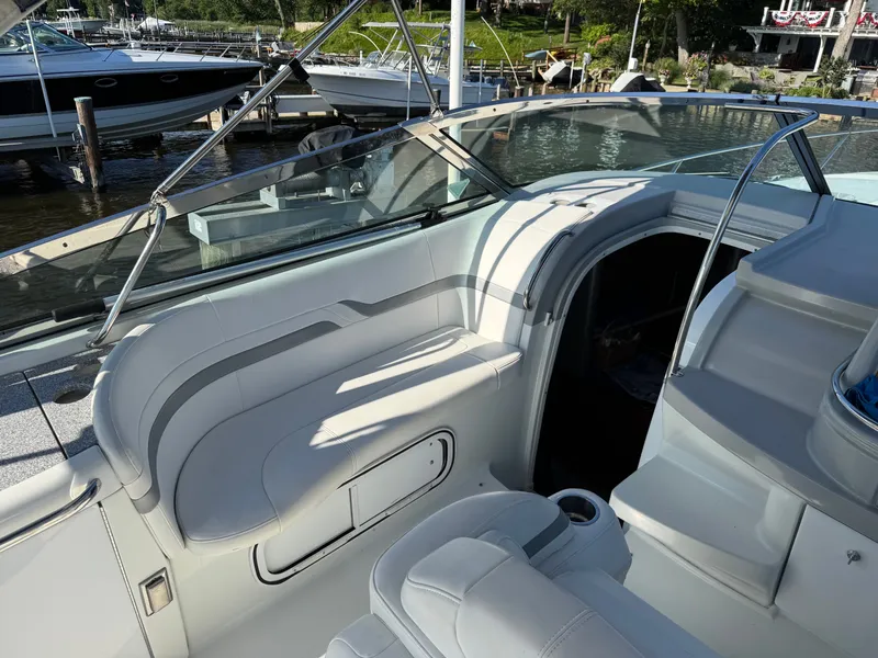 Slide: The Image of The image shows a boat's cockpit with white seating and an open entryway. - 17