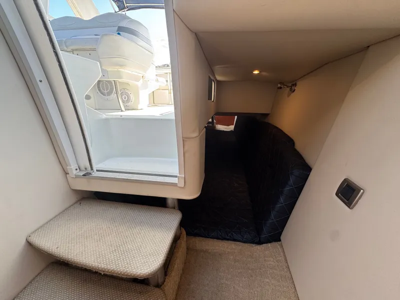 Slide: The Image of Interior of a yacht with stairs and a cushioned seating area. - 23