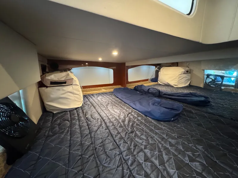 Slide: The Image of Interior of a yacht with bed and luggage. - 25