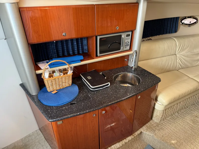Slide: The Image of Interior of a yacht with kitchenette, microwave, and leather sofa. - 28