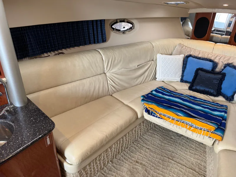 Slide: The Image of Interior of a yacht with beige sofa and colorful cushions. - 29