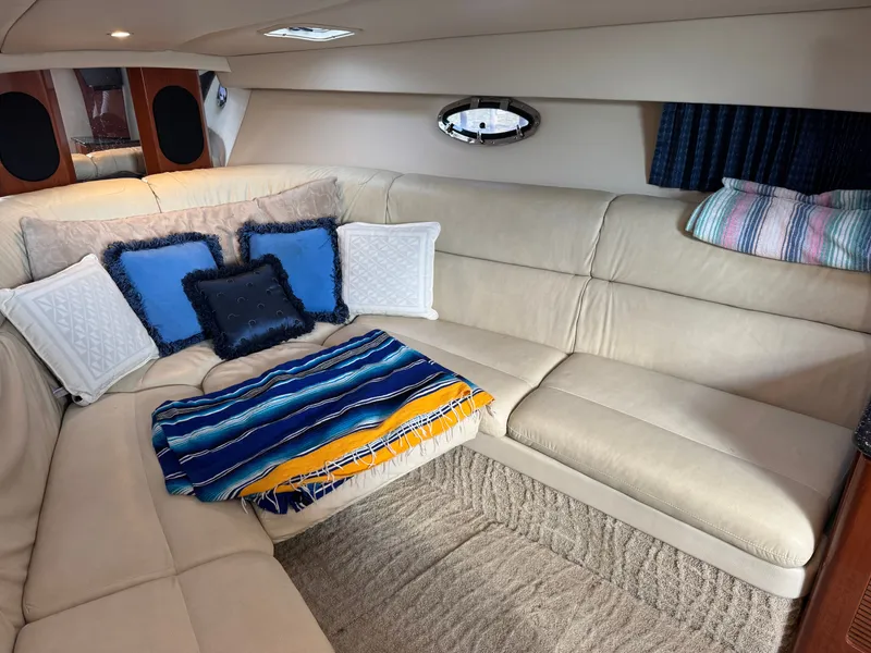 Slide: The Image of Interior of a luxurious boat cabin with beige leather sofas and colorful cushions. - 30