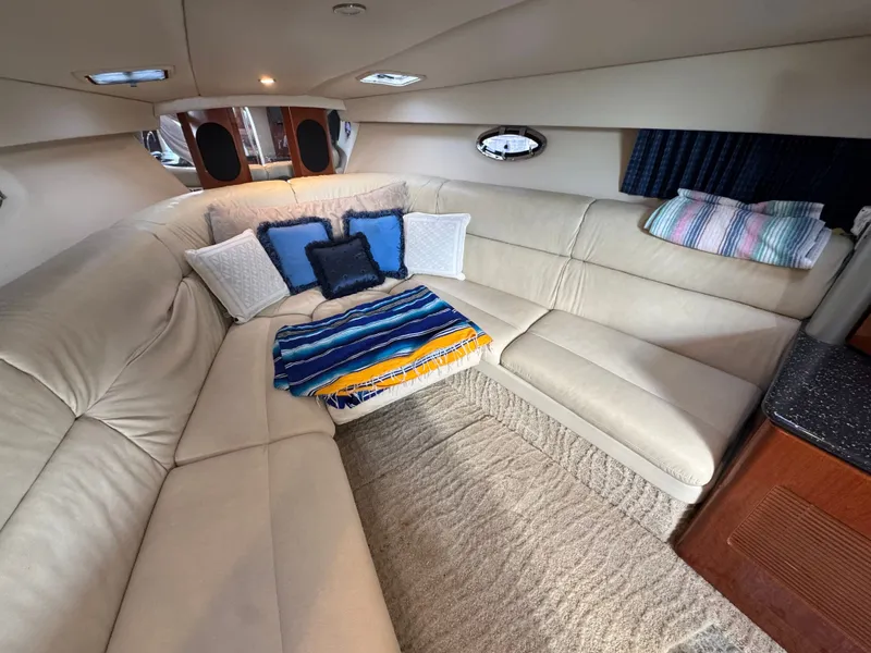 Slide: The Image of Interior of a luxury yacht with beige sofa and colorful cushions. - 31