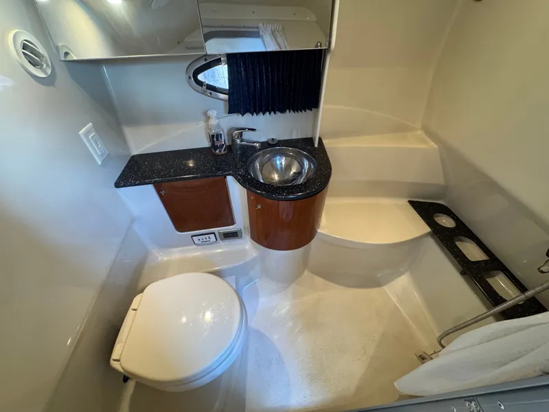 Slide: The Image of Compact bathroom with toilet, sink, and mirror inside a boat. - 40