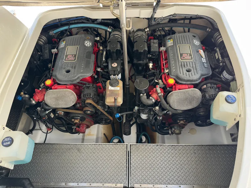 Slide: The Image of Two engines in a boat's engine compartment with various hoses and components. - 43