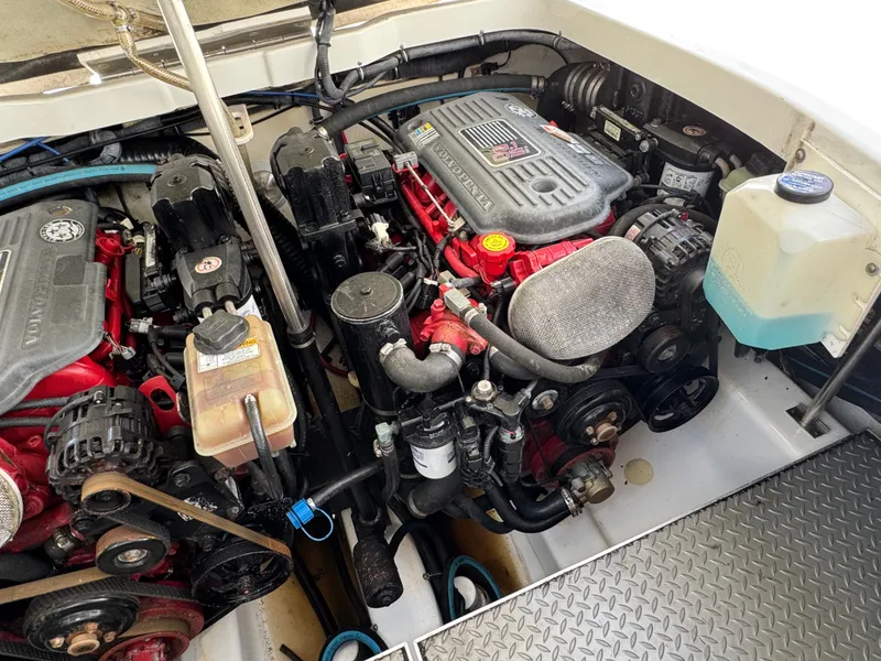 Slide: The Image of Engine compartment of a boat with two large engines and various hoses. - 44