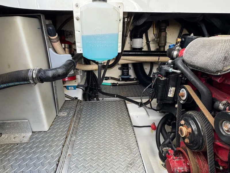 Slide: The Image of Boat engine compartment with hoses and machinery. - 45