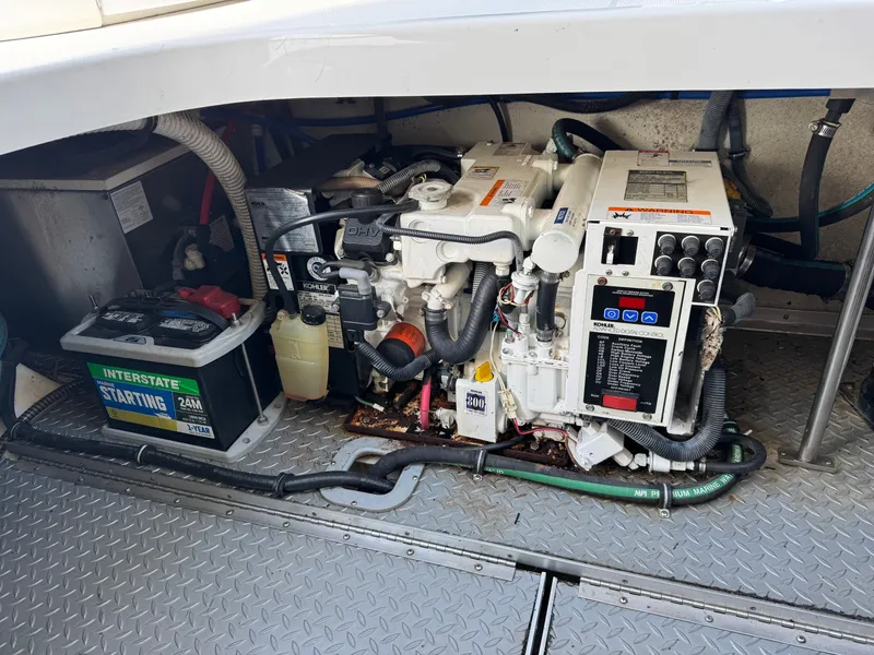 Slide: The Image of Engine compartment of a boat with generator and battery. - 46