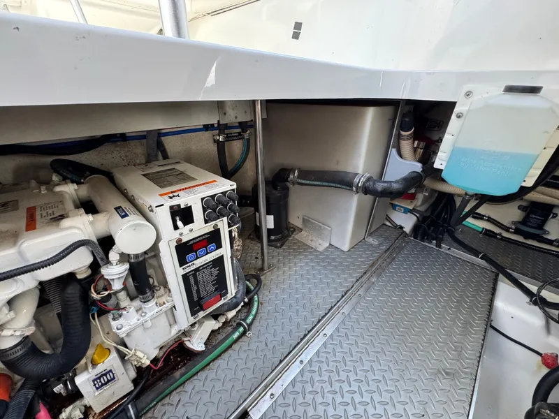Slide: The Image of The engine compartment of a boat with machinery and pipes. - 47