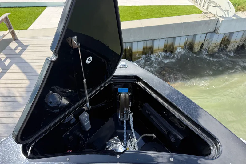 Slide: The Image of Open anchor compartment of 2023 Aviara AV36 OB boat by the dock. - 15