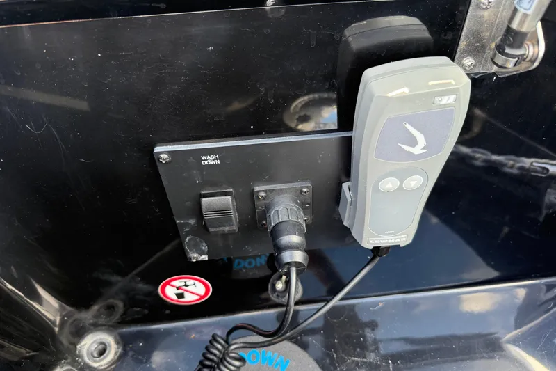 Slide: The Image of Control panel and remote on 2023 Aviara AV36 OB boat. - 17