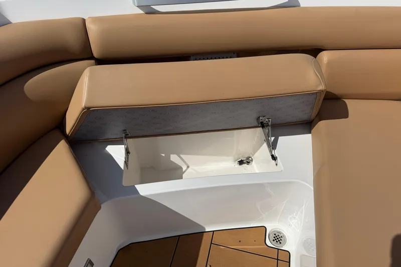 Slide: The Image of 2023 Aviara AV36 OB boat with tan seating and open storage compartment. - 18