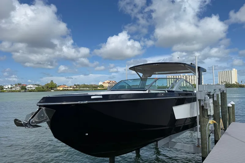 Slide: The Image of 2023 Aviara AV36 OB boat docked on a sunny day with scenic waterfront views. - 2