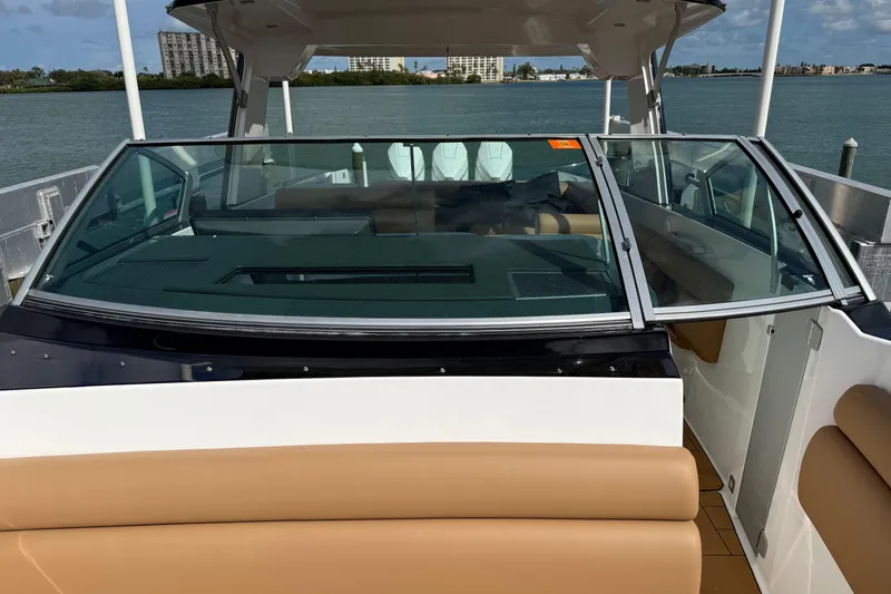 Slide: The Image of 2023 Aviara AV36 OB boat with sleek design, docked by the water. - 21