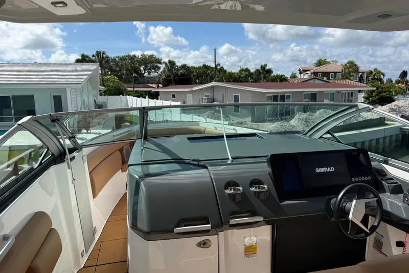 Slide: The Image of 2023 Aviara AV36 OB boat cockpit with modern dashboard and steering wheel. - 23