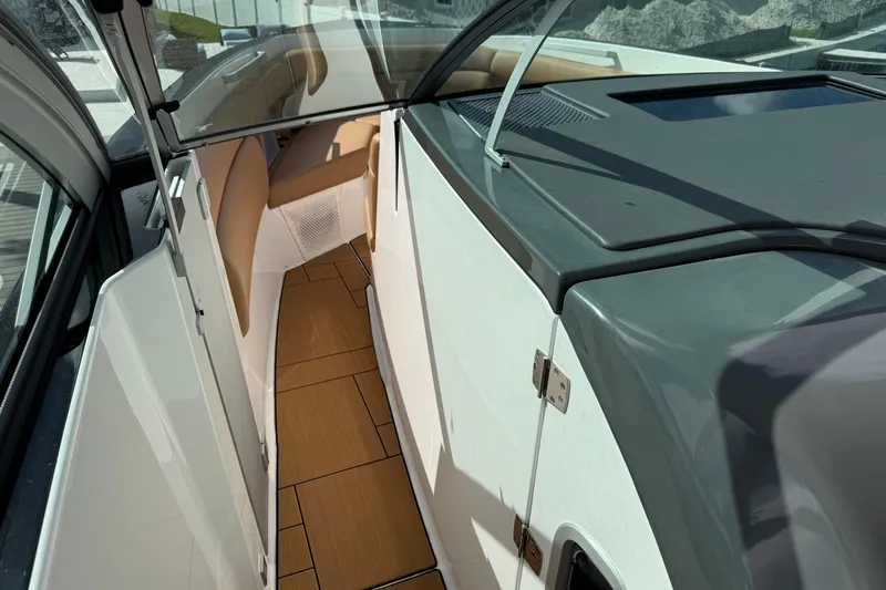 Slide: The Image of 2023 Aviara AV36 OB boat interior with sleek design and tan seating. - 24