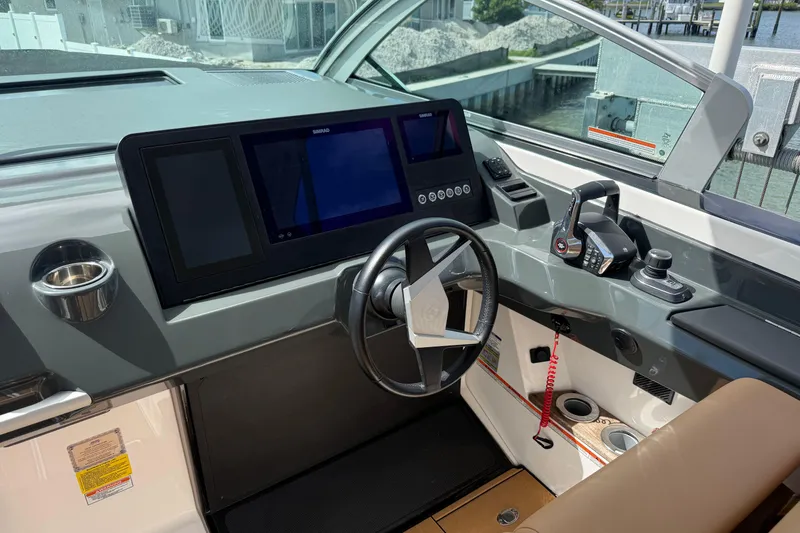 Slide: The Image of 2023 Aviara AV36 OB helm with modern controls and navigation screens. - 25