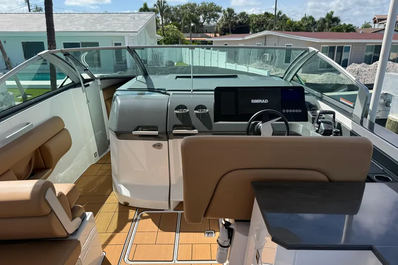 Slide: The Image of 2023 Aviara AV36 OB boat interior with modern dashboard and seating. - 27