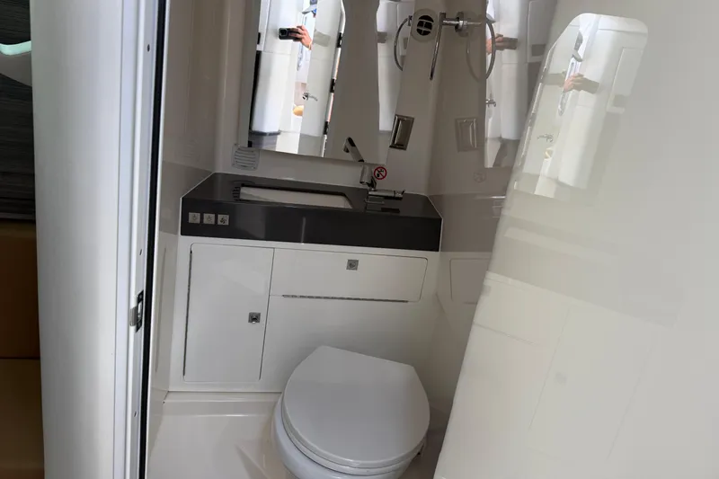 Slide: The Image of 2023 Aviara AV36 OB boat bathroom with modern sink and toilet. - 33