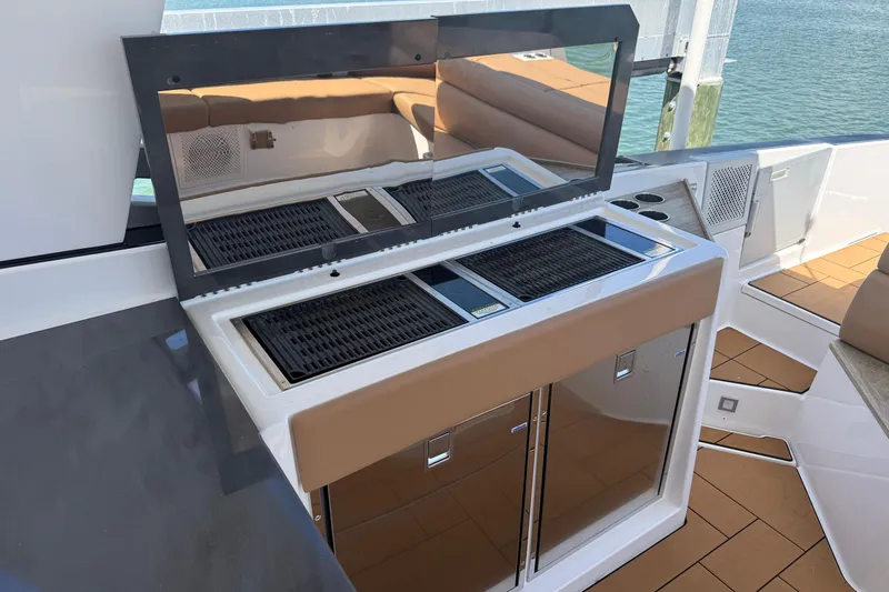 Slide: The Image of Outdoor kitchen on 2023 Aviara AV36 OB boat with grill and storage. - 40