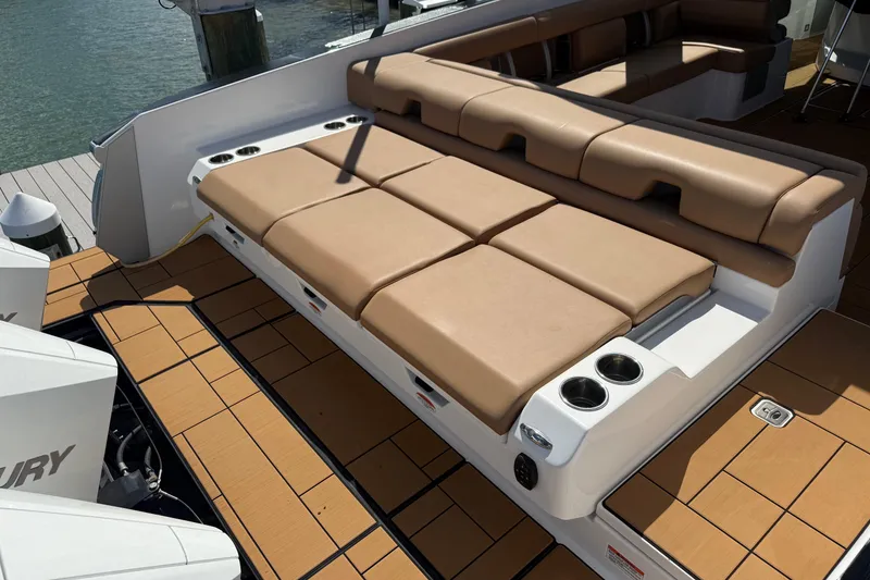 Slide: The Image of 2023 Aviara AV36 OB boat with tan seating and cup holders on deck. - 45