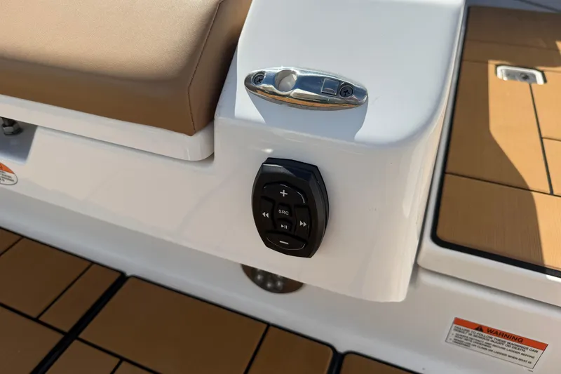 Slide: The Image of 2023 Aviara AV36 OB boat control panel with cushioned seating and teak flooring. - 48