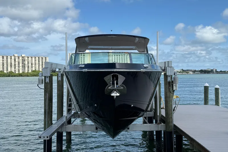 Slide: The Image of 2023 Aviara AV36 OB yacht docked with cityscape background. - 5