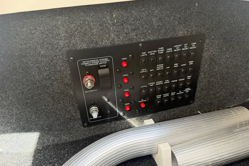 Slide: The Image of Control panel of 2023 Aviara AV36 OB boat with various switches and indicators. - 51