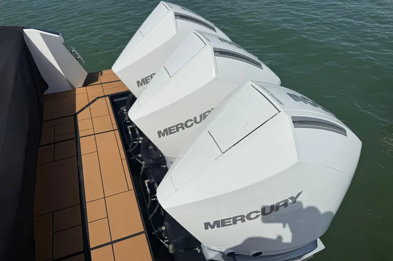 Slide: The Image of 2023 Aviara AV36 OB with triple Mercury outboard engines on water. - 54