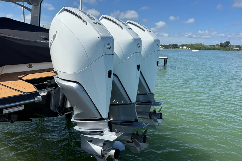 Slide: The Image of 2023 Aviara AV36 OB with triple outboard engines on a sunny day. - 55