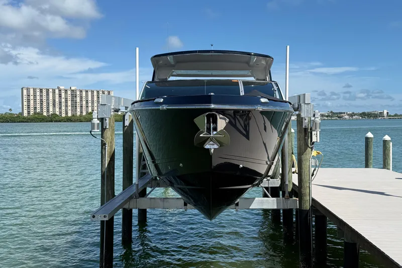 Slide: The Image of 2023 Aviara AV36 OB boat docked on a lift, with waterfront view. - 8