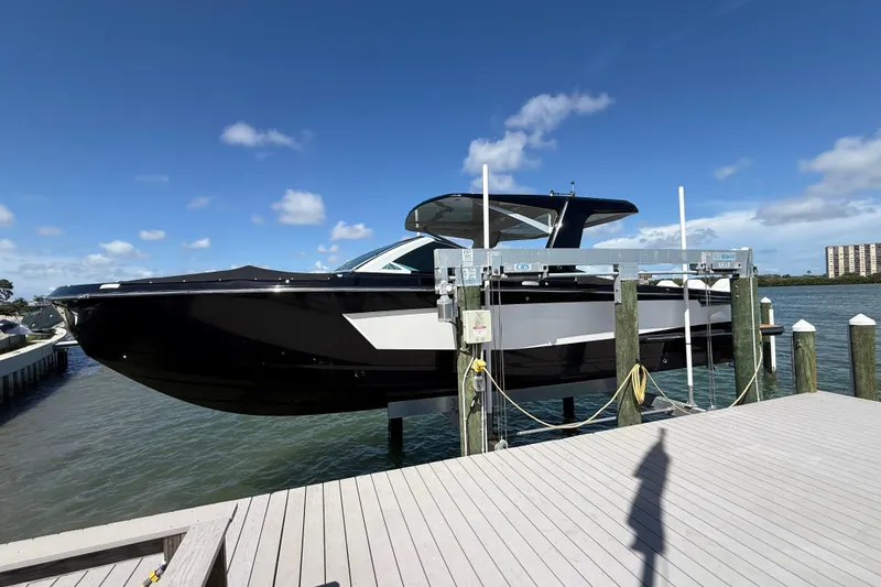 Slide: The Image of 2023 Aviara AV36 OB boat docked on a sunny day, showcasing sleek design. - 9