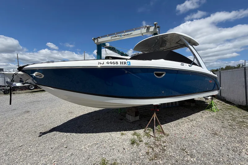 Slide: The Image of Cobalt 30SC 2021: Sleek blue and white design, propped on a gravel lot under a blue sky. - 7