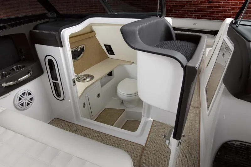 Slide: The Image of Manufacturer Provided Image: 2021 Cobalt 30SC boat interior with a compact bathroom and seating area. - 13