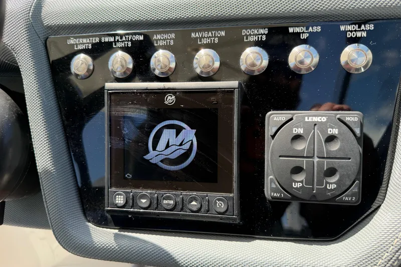 Slide: The Image of Control panel of a 2021 Cobalt 30SC boat with various light and windlass switches. - 31