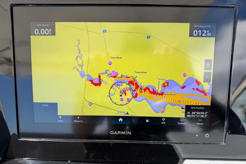 Slide: The Image of Garmin GPS display on 2021 Cobalt 30SC showing Toms River navigation map. - 28