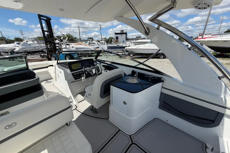 Slide: The Image of Interior of a 2021 Cobalt 30SC boat with modern helm and seating. - 20