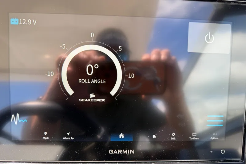 Slide: The Image of Garmin display showing Seakeeper roll angle at 0° on Cobalt 30SC, 2021 model. - 27