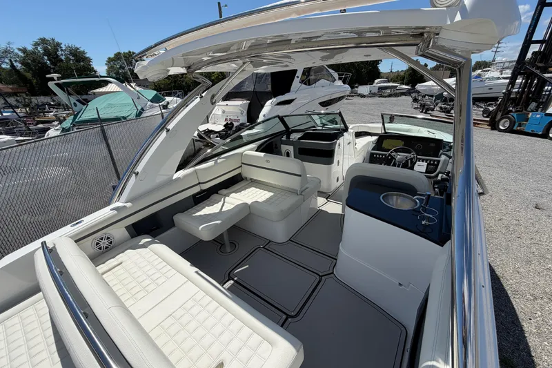 Slide: The Image of 2021 Cobalt 30SC boat interior with luxurious seating and modern dashboard. - 15