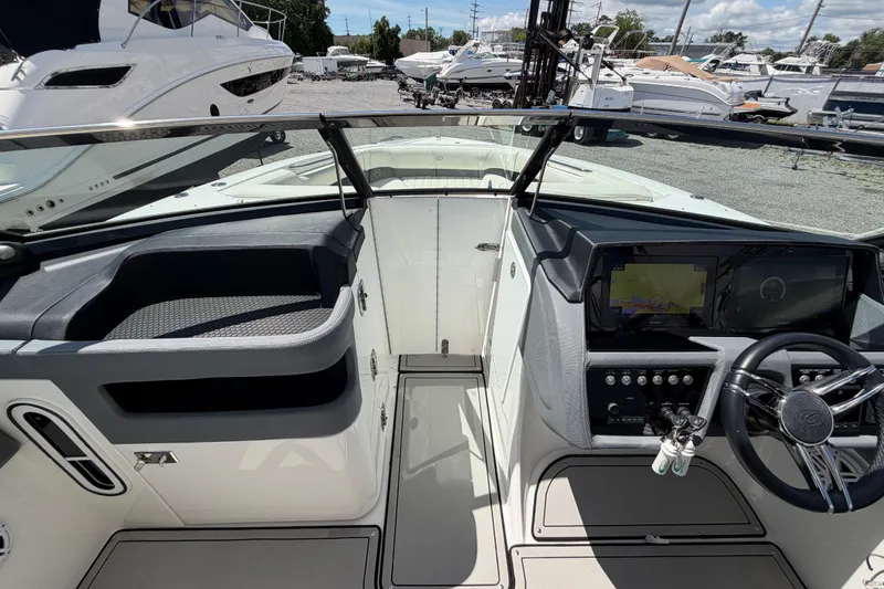 Slide: The Image of 2021 Cobalt 30SC boat cockpit with modern dashboard and steering wheel. - 41
