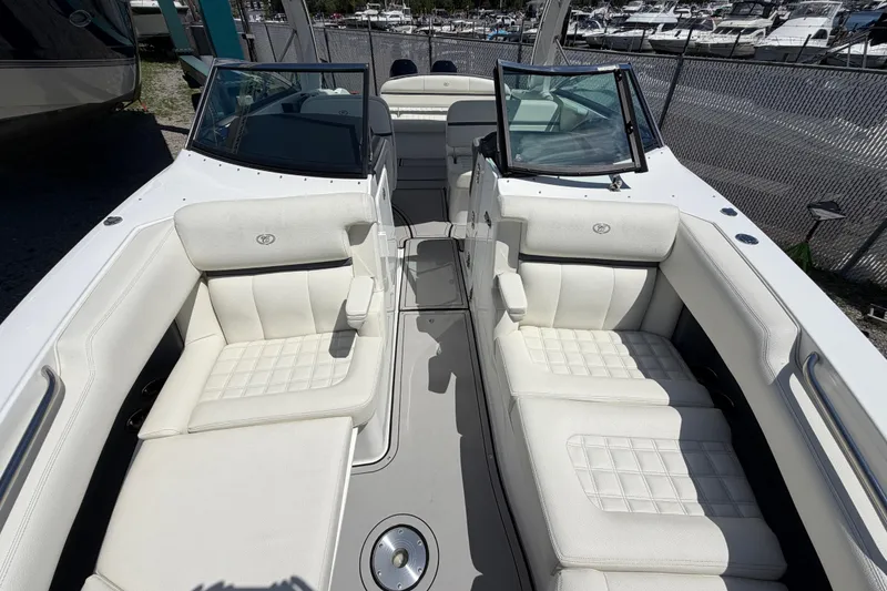 Slide: The Image of 2021 Cobalt 30SC boat interior with luxurious white seating and open windshield. - 39