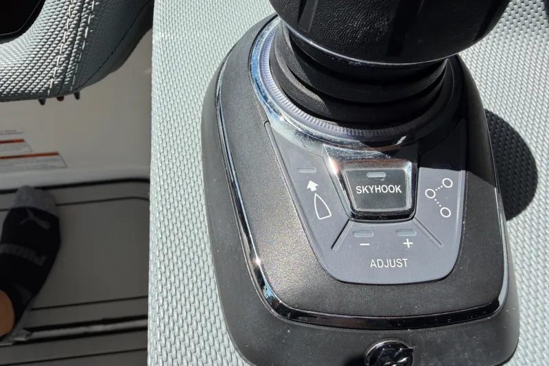 Slide: The Image of Control panel of a 2021 Cobalt 30SC boat featuring Skyhook and adjust buttons. - 26